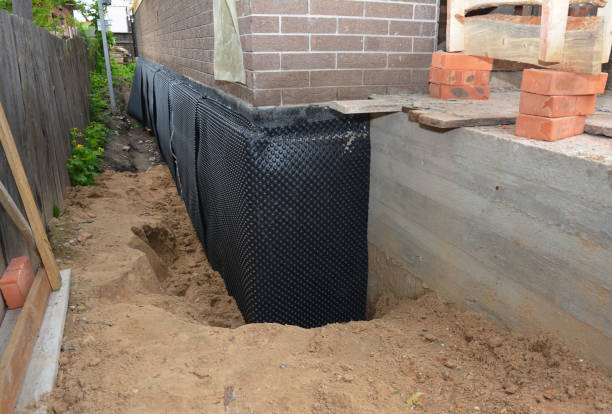 Happy homeowners after waterproofing job in Hanna